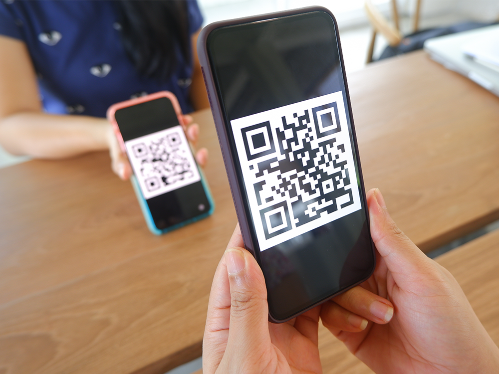 Touchless check-in with QR code scanning on mobile phones