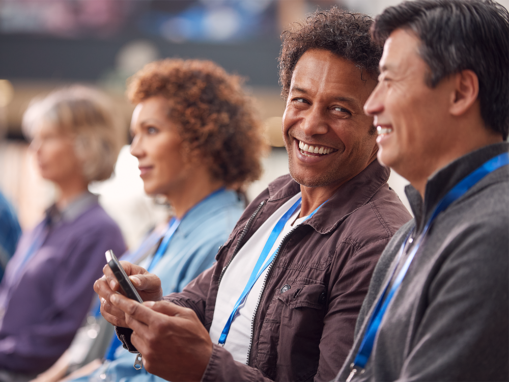 People networking at an event using mobile phones